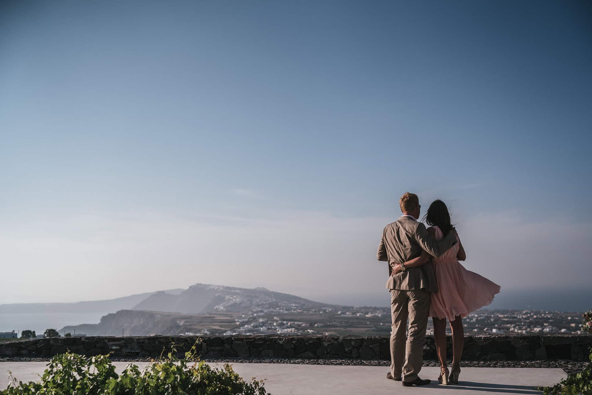 Wedding guests look out towards Fira from Saint Antonio Vineyard, Pyrgos.