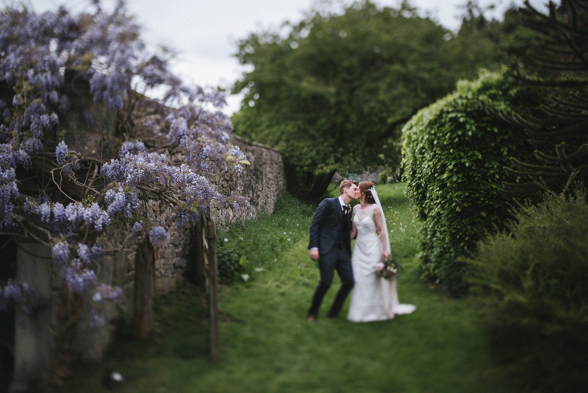 The month of May presents beautiful tones of green and Wisteria pinks Trevor Hall Wedding Photographer