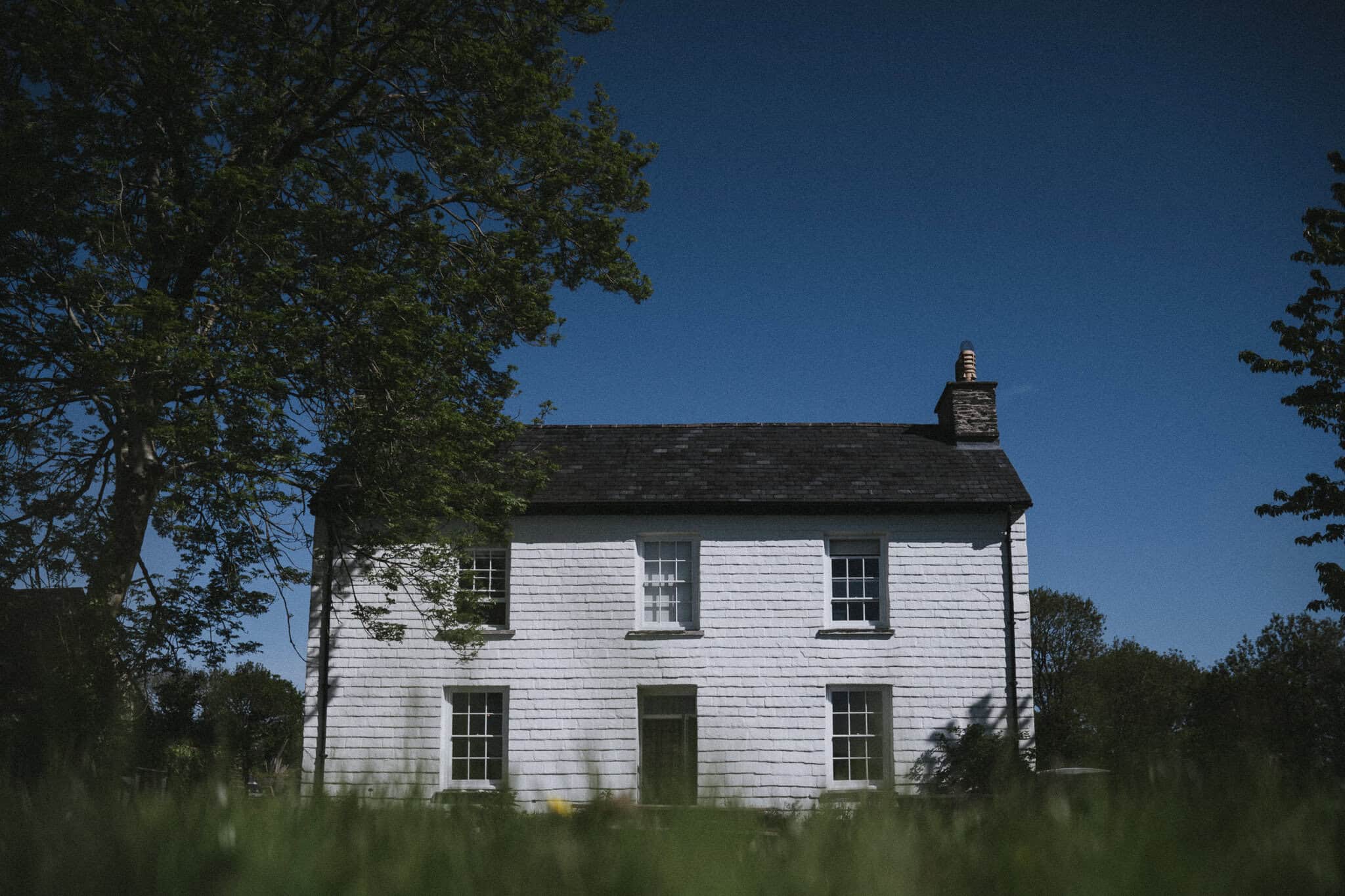 Fforest Farm farmhouse in the early morning sun